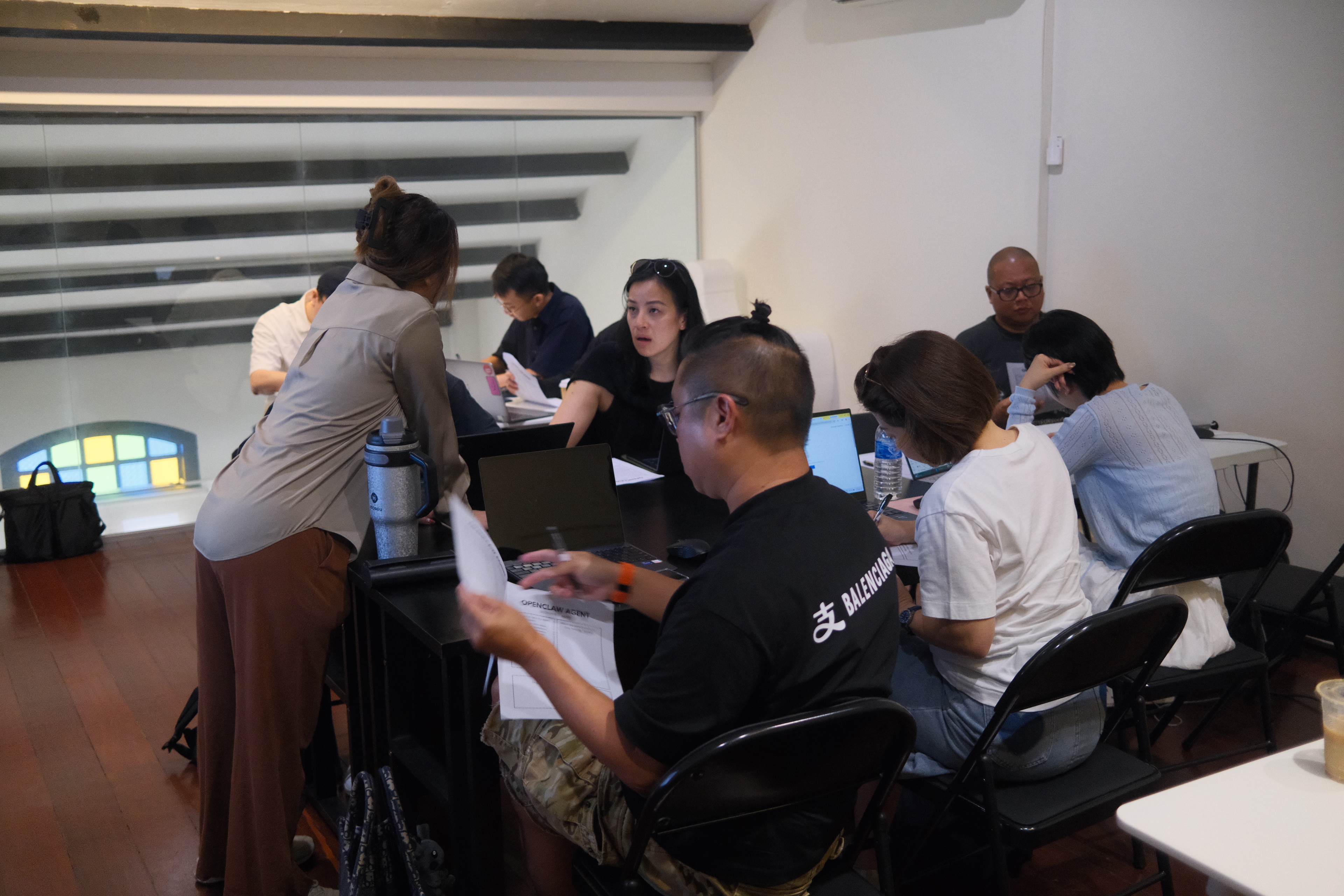 Builders deep in hands-on agent setup at Workshop #03